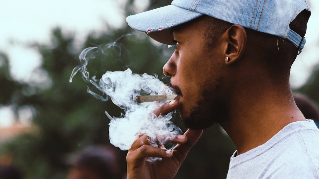 Man smoking a joint.