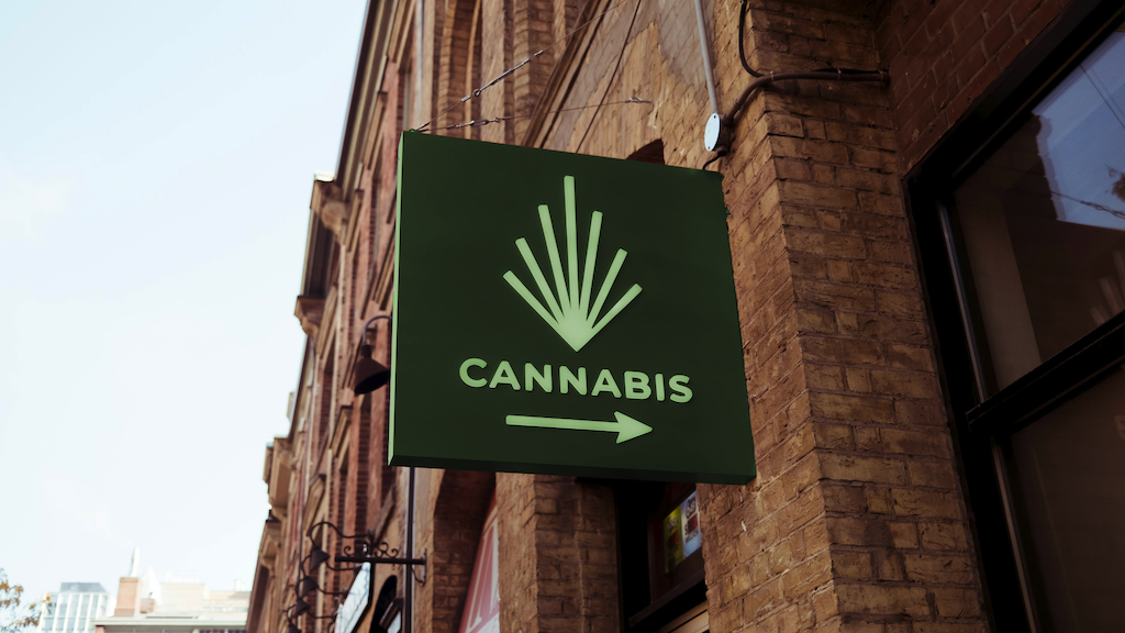 Exterior cannabis store business sign that reads 'cannabis'.